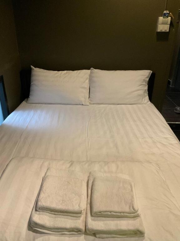 Postel nebo postele na pokoji v ubytování Capsule Hostel Chiangkhan