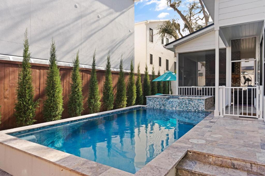 a swimming pool in the backyard of a house at Take It Easy - 104 Gould Street in King City