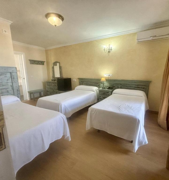 Postel nebo postele na pokoji v ubytování Hotel Chipiona