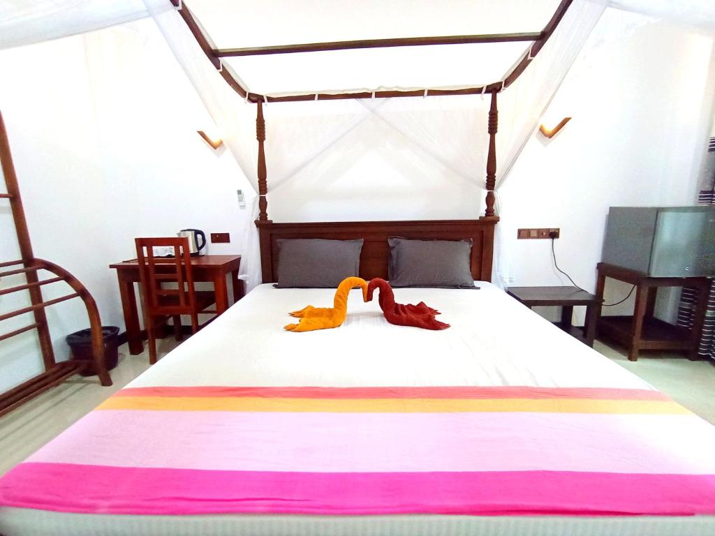 Postel nebo postele na pokoji v ubytování Ramesh Guesthouse