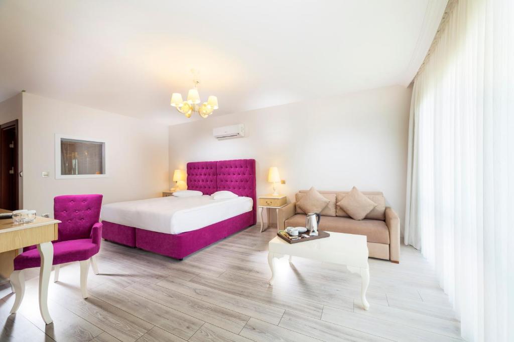 Postel nebo postele na pokoji v ubytování Motali Life Hotel