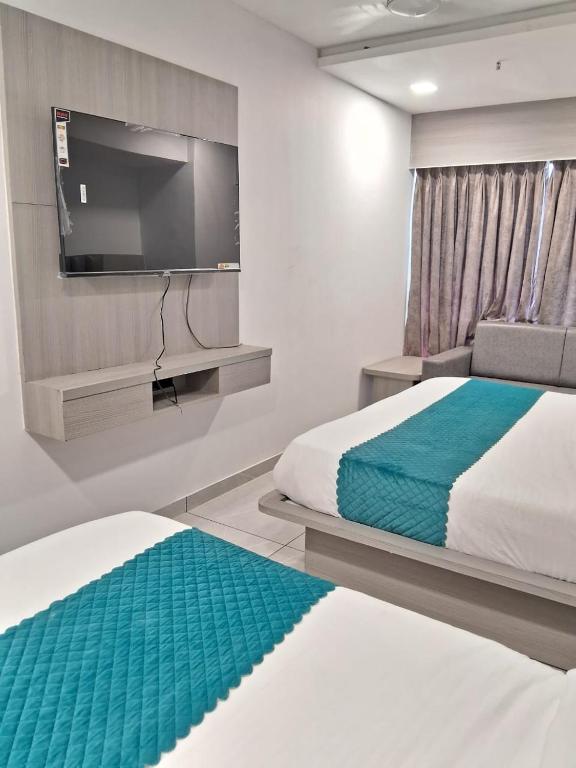 Postel nebo postele na pokoji v ubytování Hotel Shaligram Inn