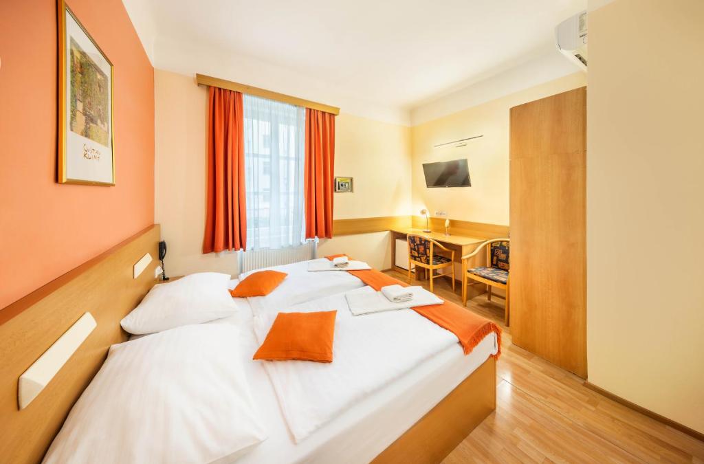 Postel nebo postele na pokoji v ubytování Residence Tabor