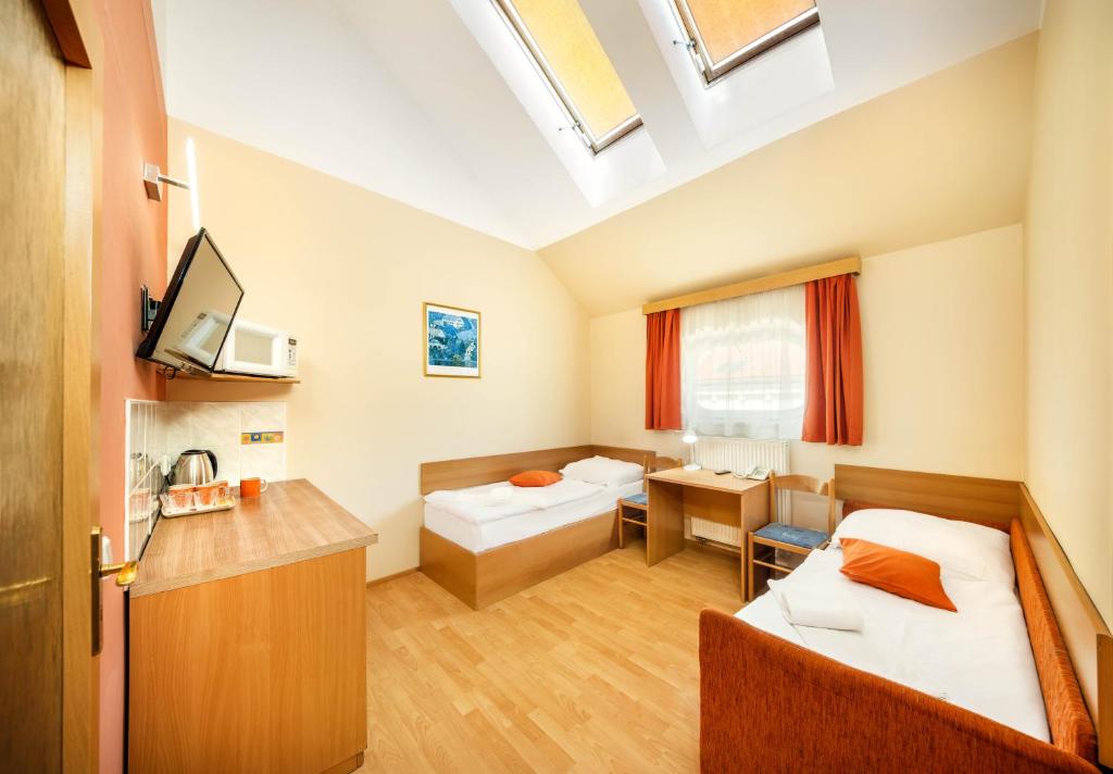 Postel nebo postele na pokoji v ubytování Residence Tabor