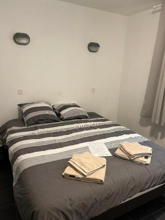 Postel nebo postele na pokoji v ubytování L'alliance de Sologne