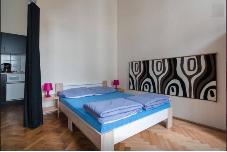 Posteľ alebo postele v izbe v ubytovaní SparrOwl Apartments