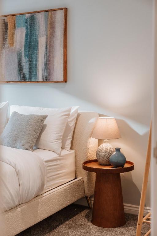 a living room with a couch and a table with a lamp at 2 Bed Apartment Overlooking the Square Step Out to Shops & Dining in Shrewsbury