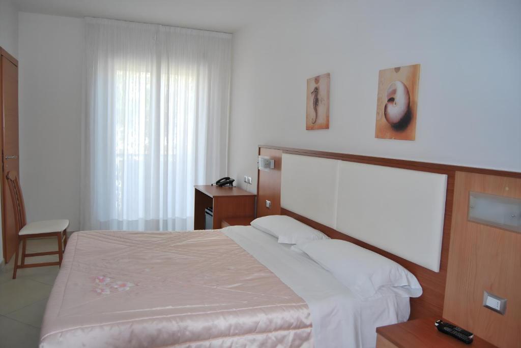 Postel nebo postele na pokoji v ubytování Eu ropa Hotel