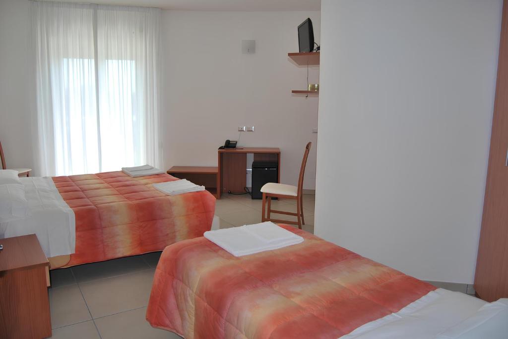 Postel nebo postele na pokoji v ubytování Eu ropa Hotel