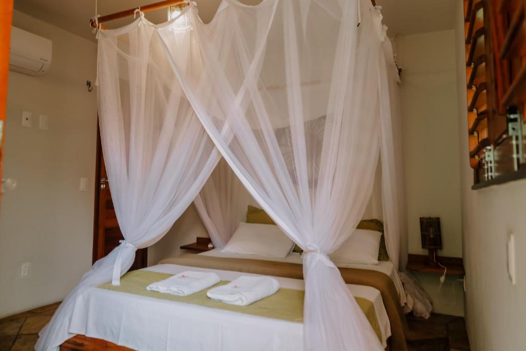 Postel nebo postele na pokoji v ubytování Casas Capulana