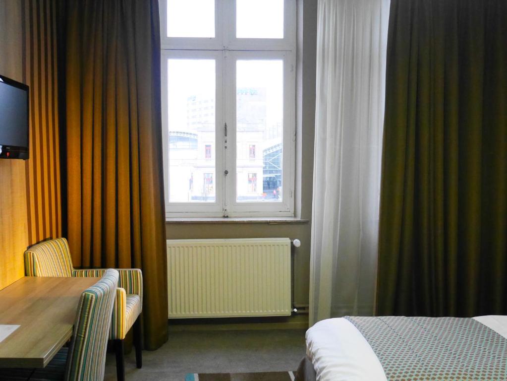 Postel nebo postele na pokoji v ubytování Hotel Mille Colonnes
