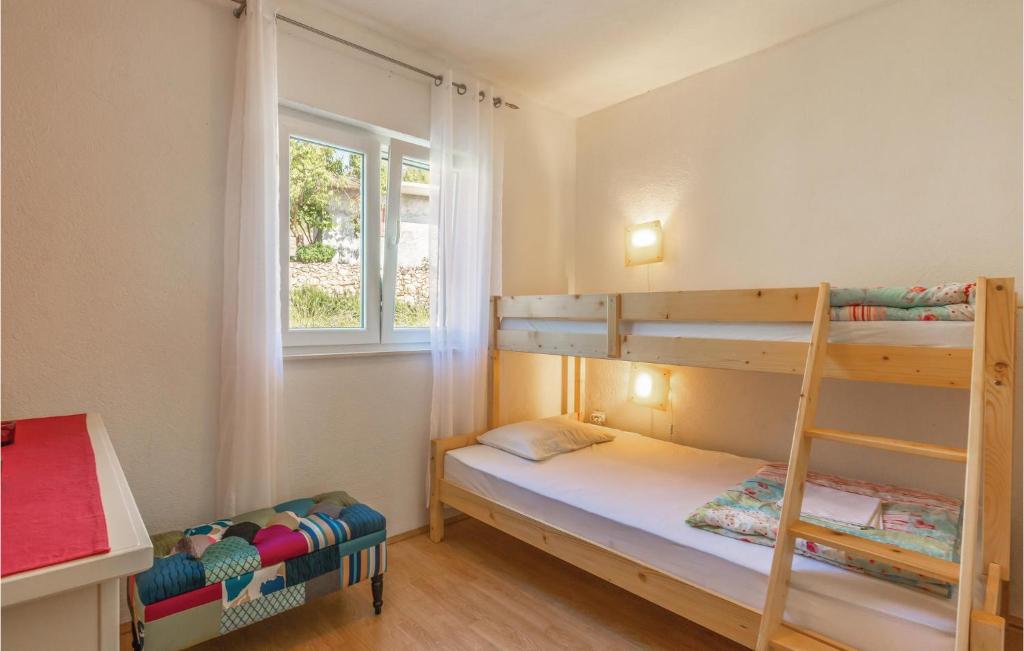 Postel nebo postele na pokoji v ubytování Holiday Home Vojnic Sinjski 11