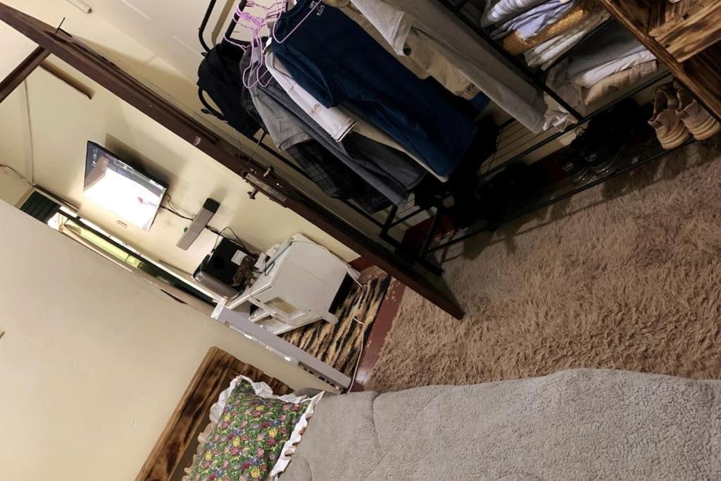 an overhead view of a room with a bed and a room at Charming Double House in Jinja in Jinja