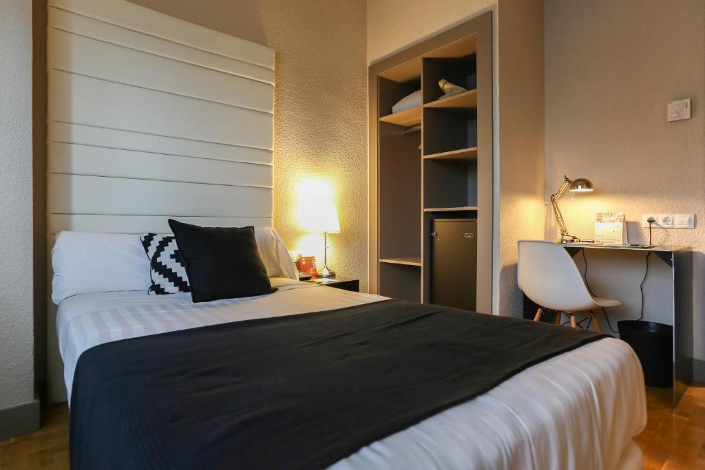 Postel nebo postele na pokoji v ubytování Habitus Hotel Leyre