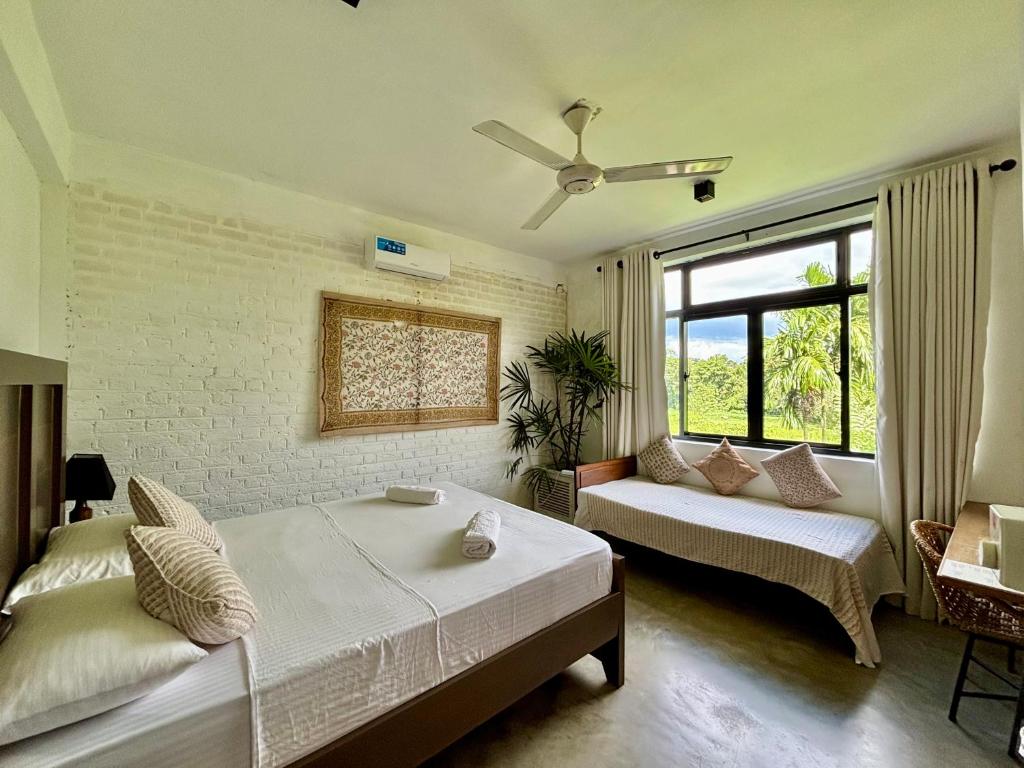 Postel nebo postele na pokoji v ubytování Rai Villa Colombo