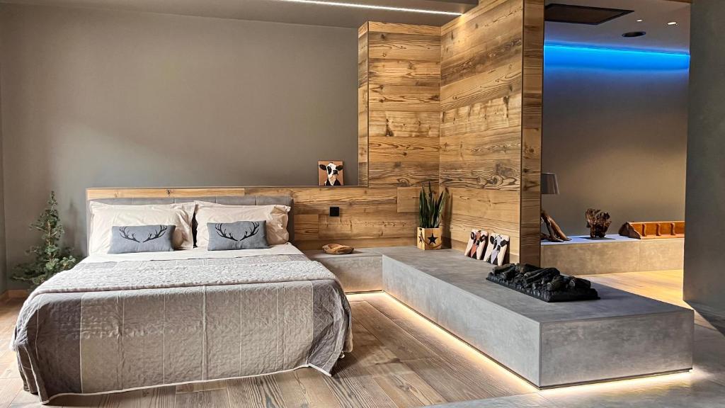 Postel nebo postele na pokoji v ubytování Agarthi Suites - Valtellina