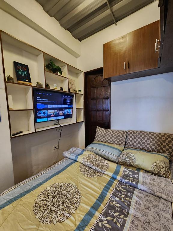 Ένα ή περισσότερα κρεβάτια σε δωμάτιο στο Studio Unit for 2pax