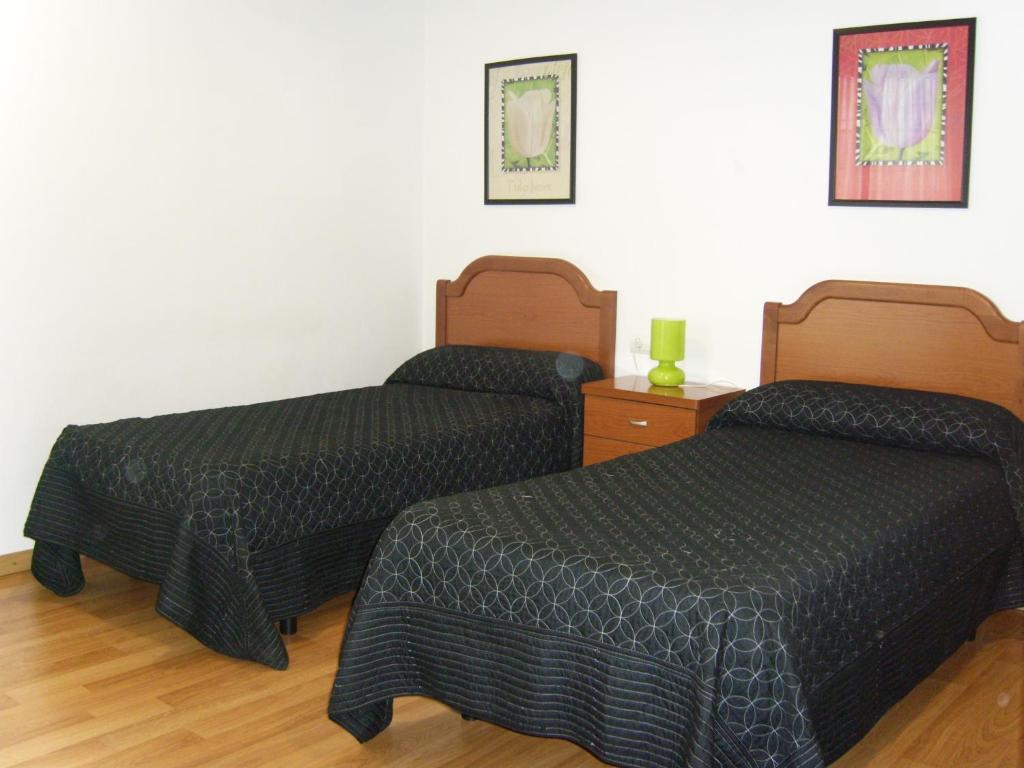 Postel nebo postele na pokoji v ubytování Hostal Las Eras