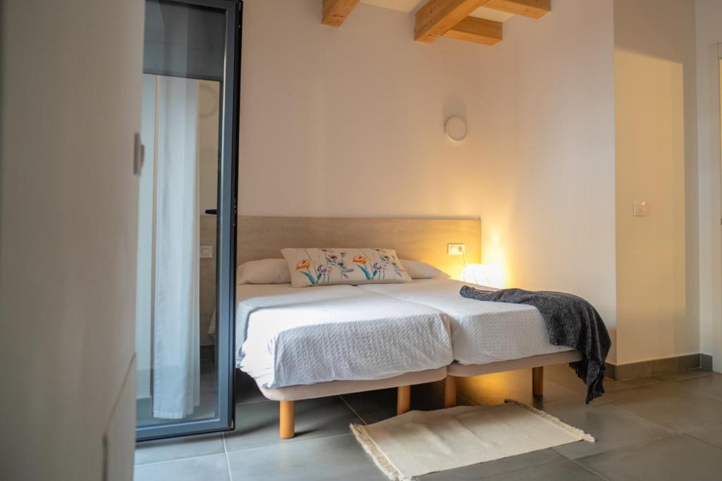 Postel nebo postele na pokoji v ubytování Ca lEspardenyer