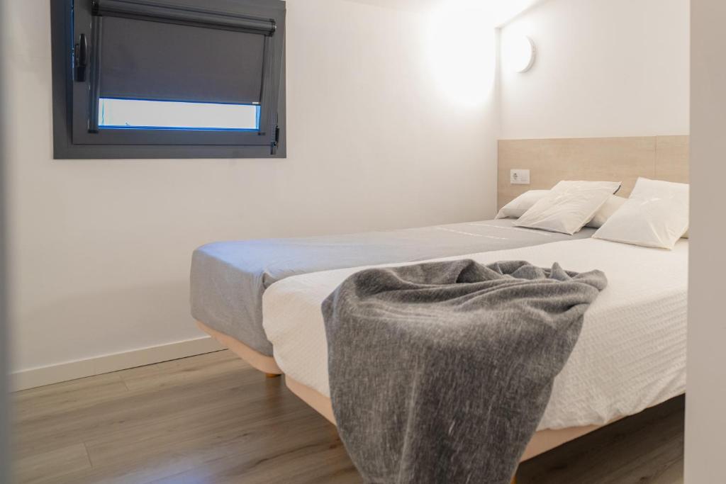 Postel nebo postele na pokoji v ubytování Ca lEspardenyer