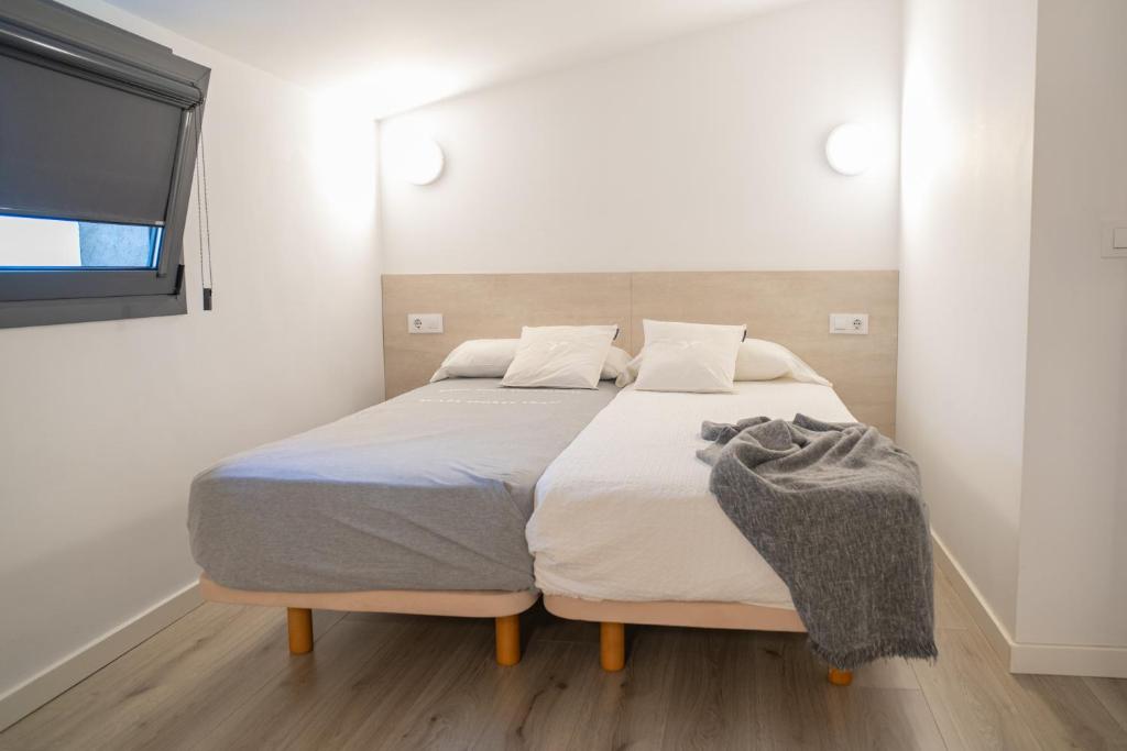 Postel nebo postele na pokoji v ubytování Ca lEspardenyer