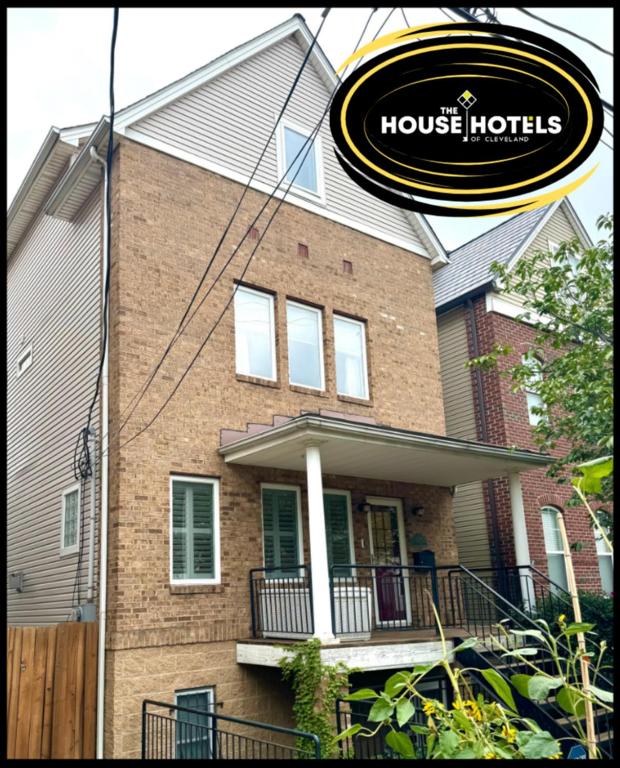 a house with a sign in front of it at Large 3 Bedroom, Tremont House, minutes from everything!! in The Angle