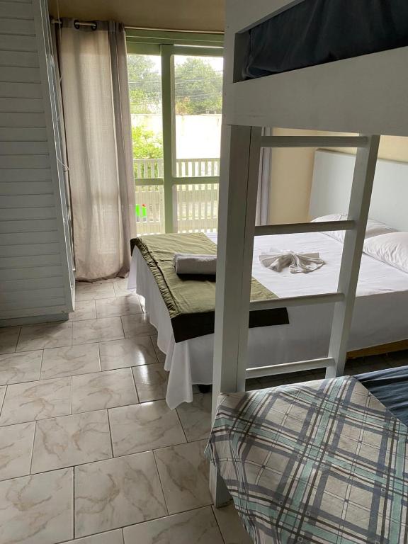 Postel nebo postele na pokoji v ubytování Hotel Morada de Leste Pontal