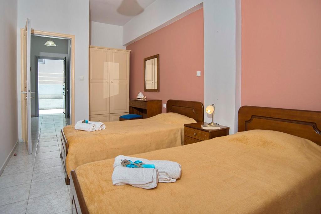 Postel nebo postele na pokoji v ubytování Olympia Central