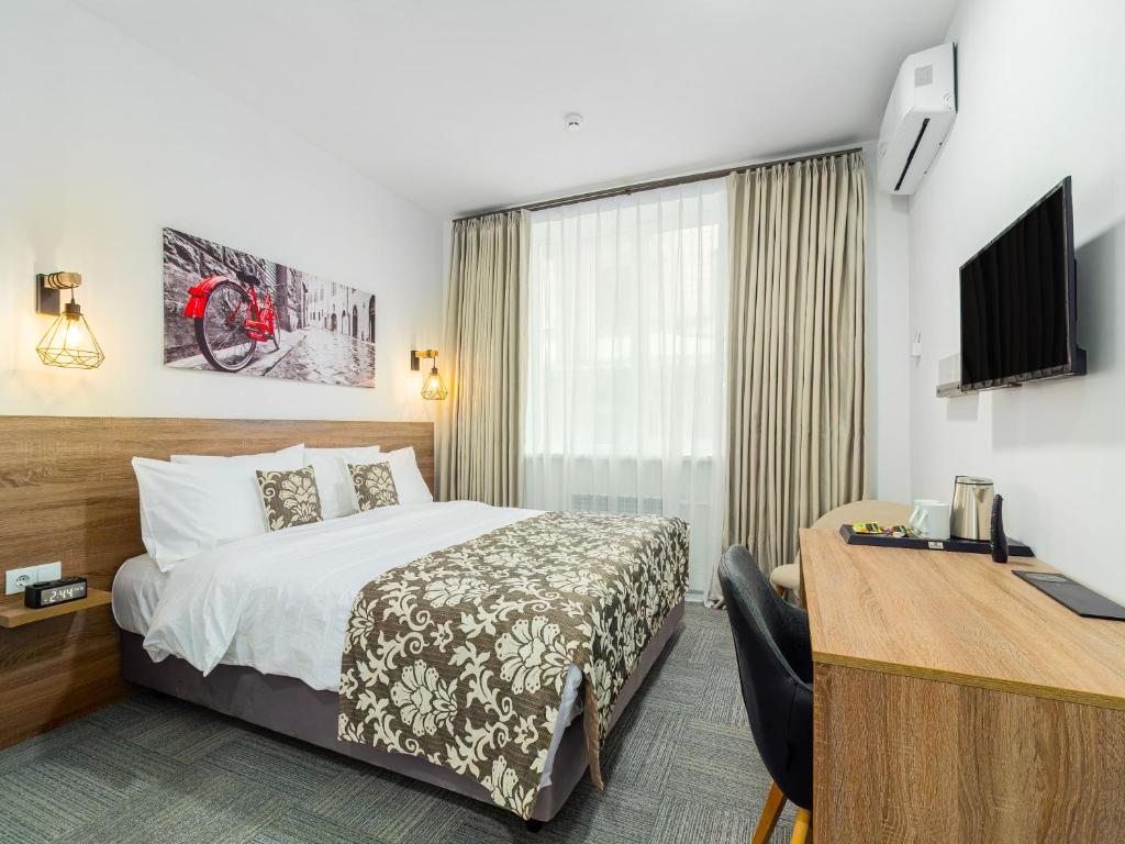 TV a/nebo společenská místnost v ubytování TA Collection Hotel