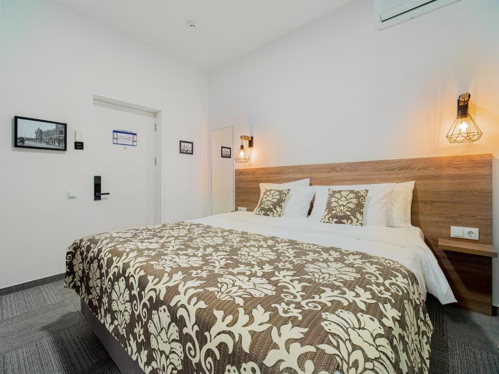 Postel nebo postele na pokoji v ubytování TA Collection Hotel