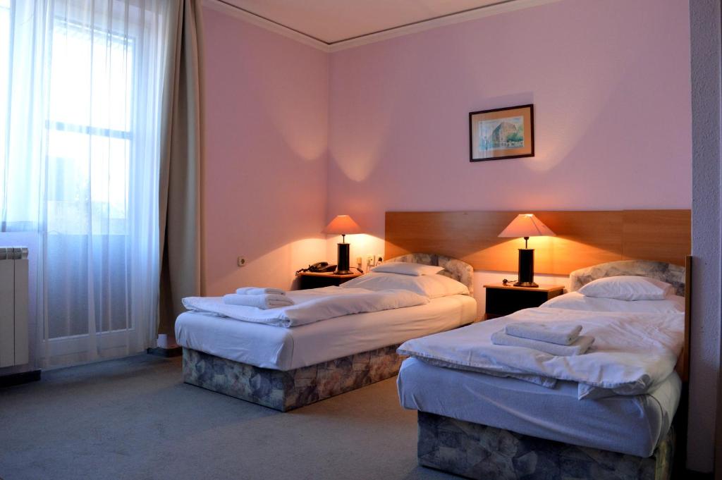 Postel nebo postele na pokoji v ubytování Apollo Motel