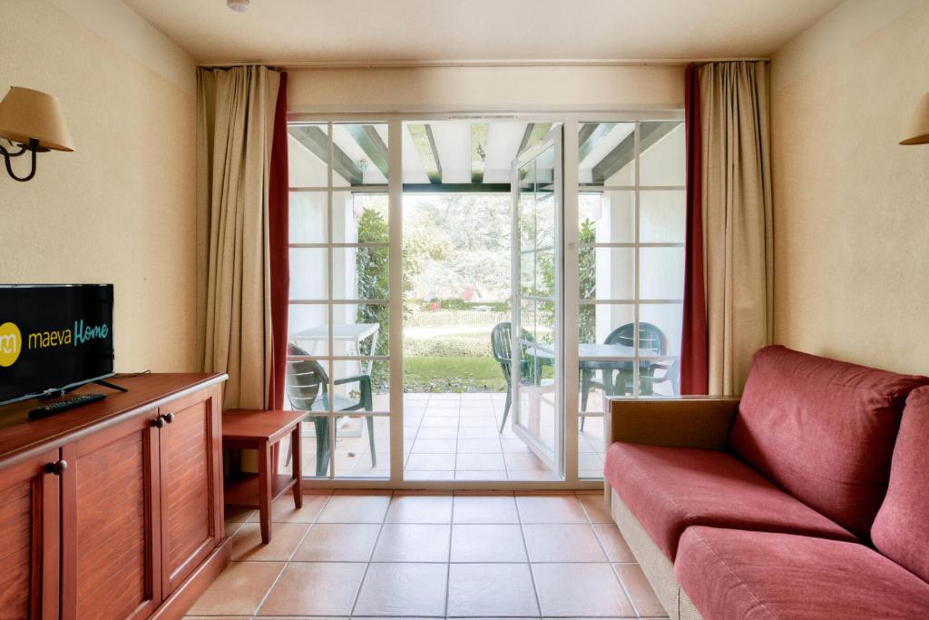 TV a/nebo společenská místnost v ubytování Résidence Le Parc d'Arradoy - maeva Home - Appartement 2 pièces 4 personnes - Confort MAE-4554
