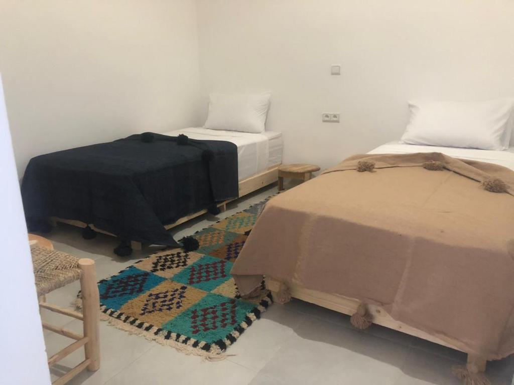 Postel nebo postele na pokoji v ubytování Riad Nomad House Marrakech