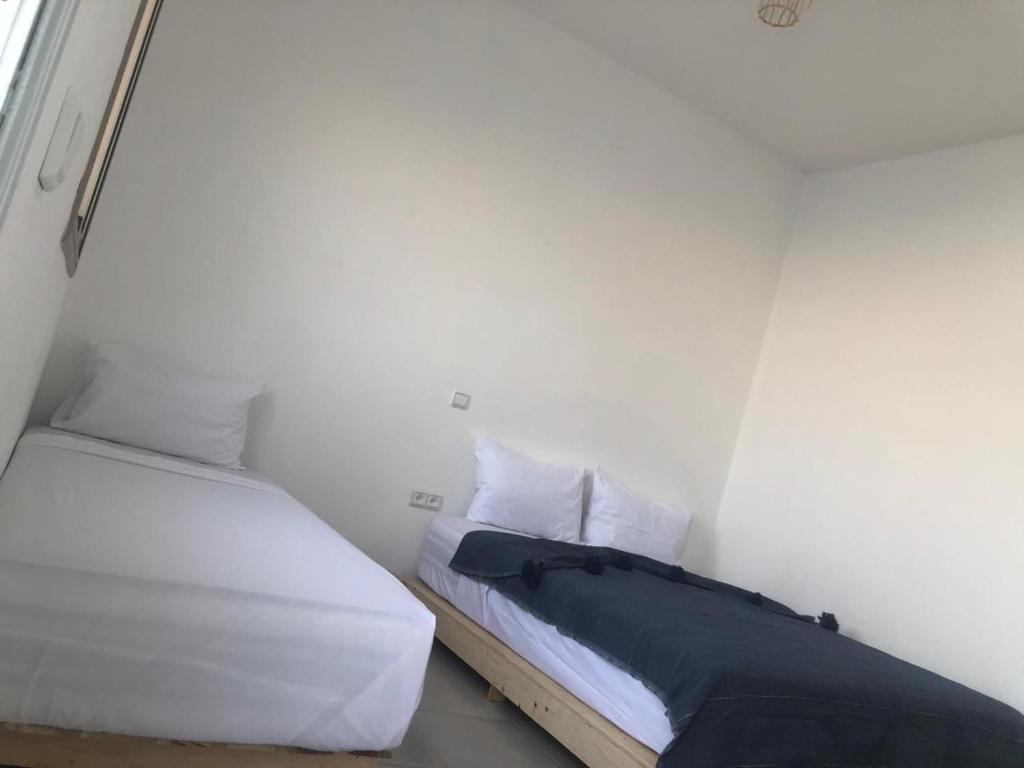Postel nebo postele na pokoji v ubytování Riad Nomad House Marrakech