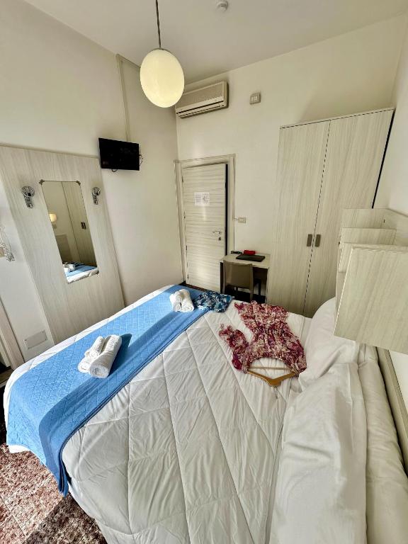 Postel nebo postele na pokoji v ubytování Hotel Napoleon