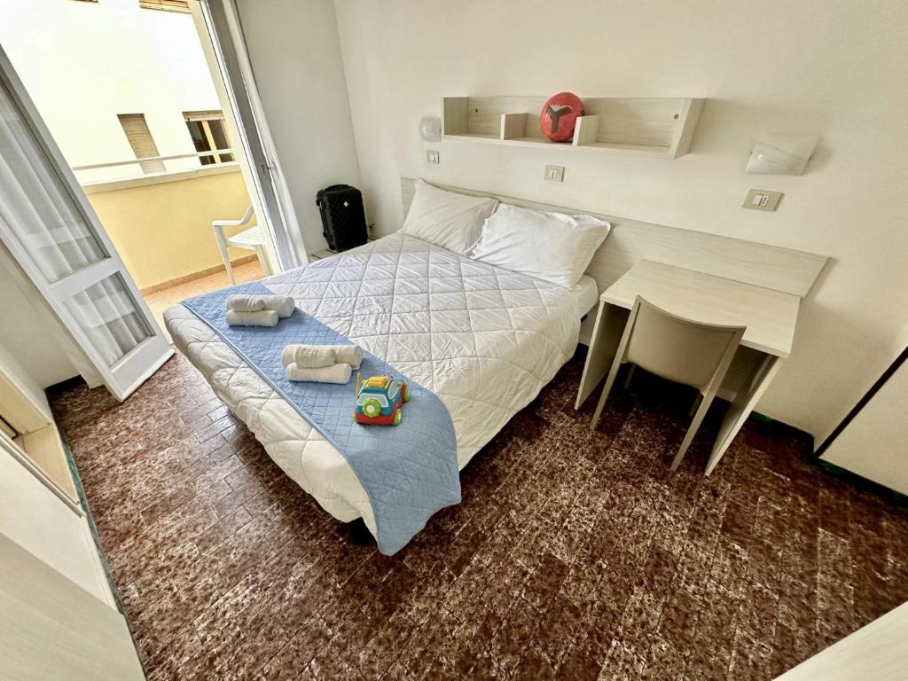 Postel nebo postele na pokoji v ubytování Hotel Napoleon