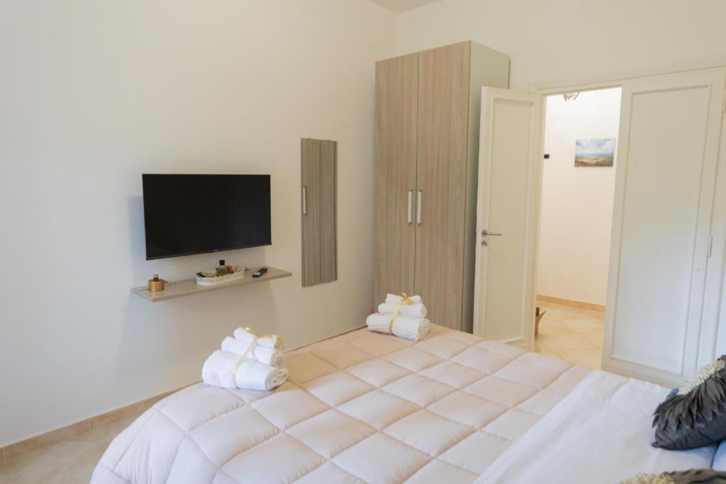 Ένα ή περισσότερα κρεβάτια σε δωμάτιο στο Zia Lulù apartment