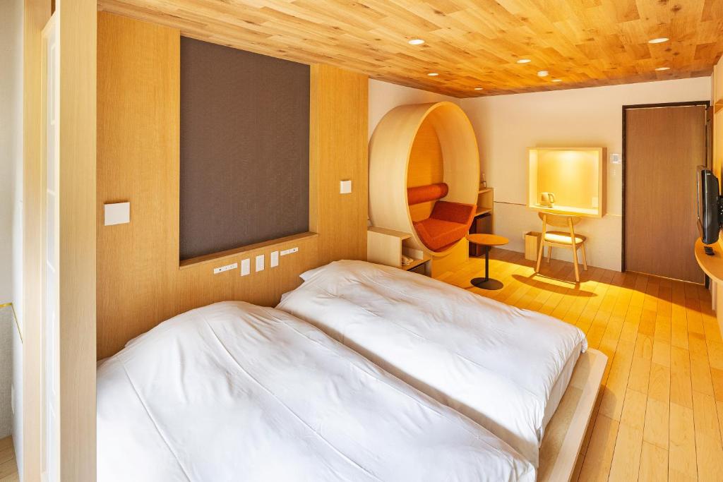 Cama o camas de una habitación en Hidamari Ichinoyu
