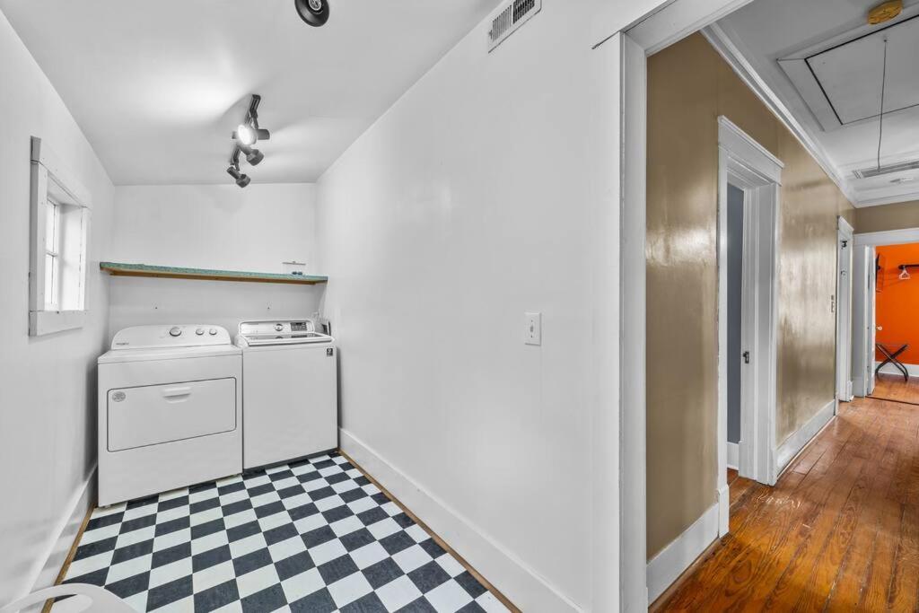 a kitchen with a stove and a checkered floor at Half Off SALE! Downtown Home with King Bed FirePit Free Parking and Huge Back Yard Filming Allowed in Wilmington