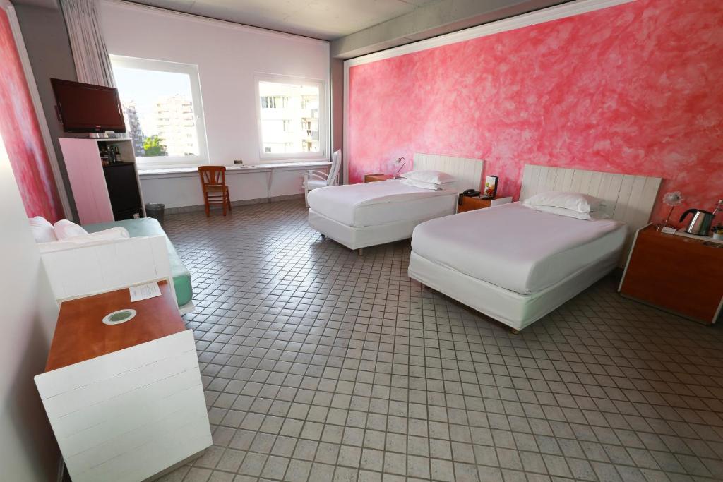 A bed or beds in a room at The Marmara Antalya