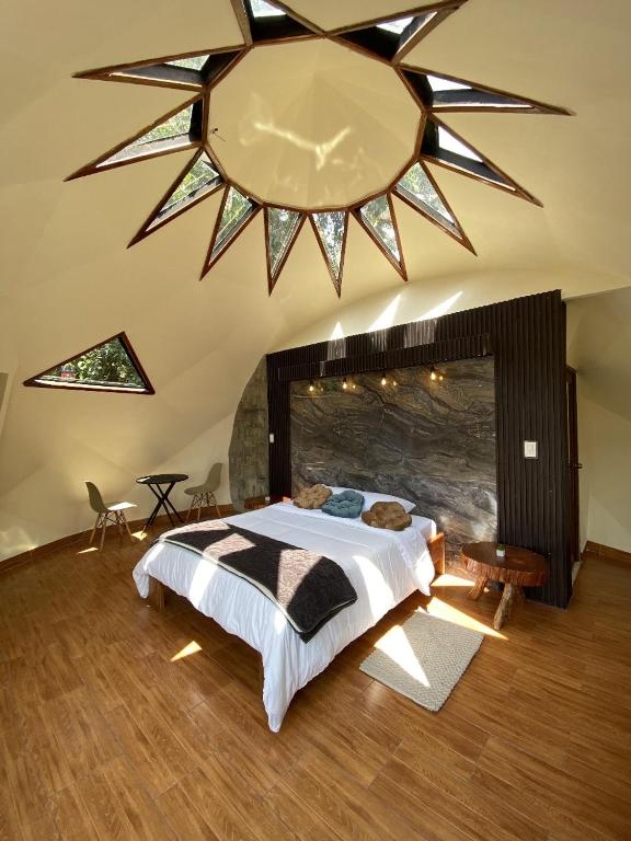 Postel nebo postele na pokoji v ubytování GLAMPING MINDO SUYANA
