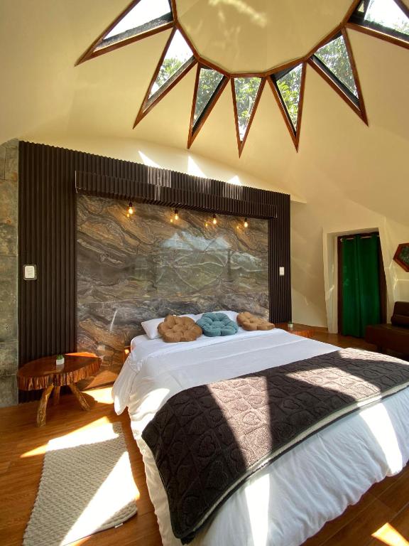 Postel nebo postele na pokoji v ubytování GLAMPING MINDO SUYANA