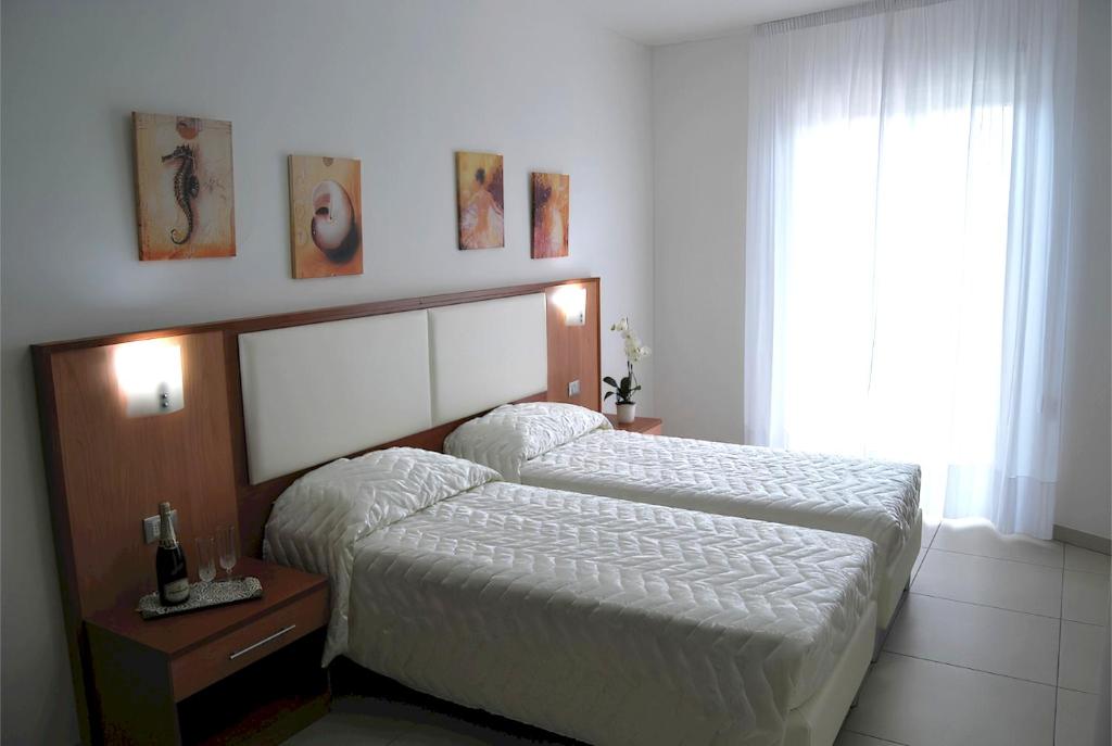 Postel nebo postele na pokoji v ubytování Eu ropa Hotel