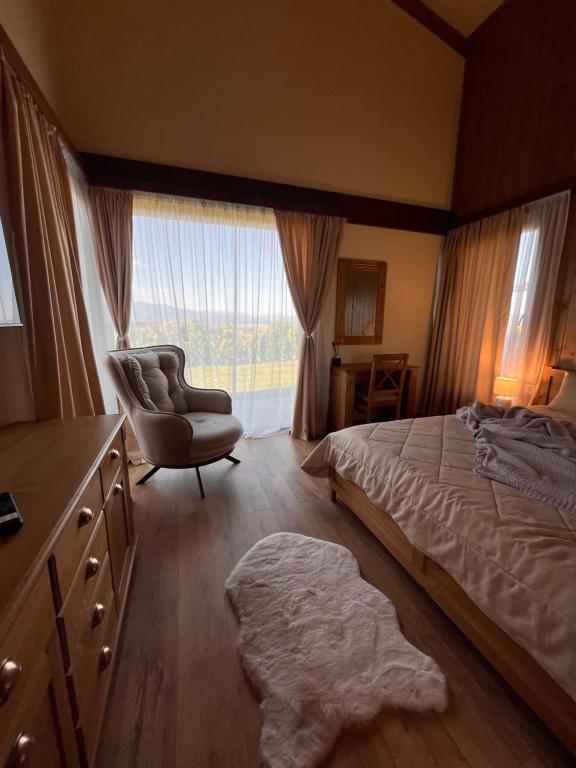 Postel nebo postele na pokoji v ubytování Pirin Golf Villa Relax