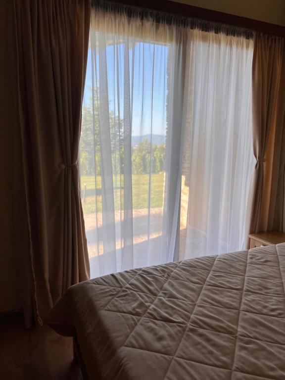 Postel nebo postele na pokoji v ubytování Pirin Golf Villa Relax