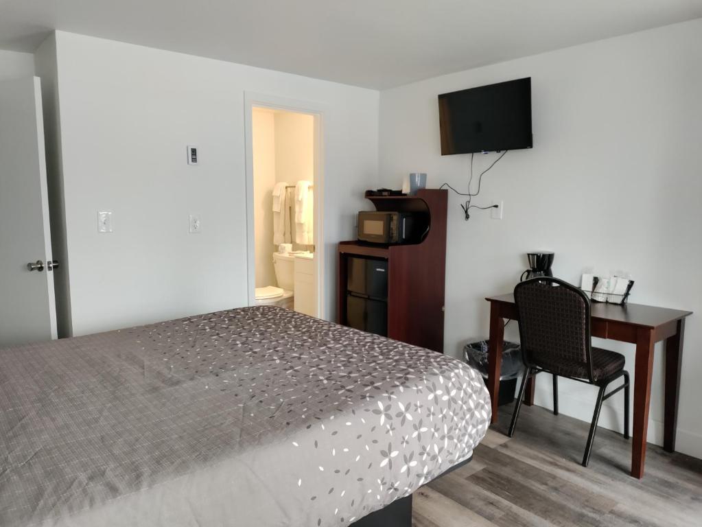 TV a/nebo společenská místnost v ubytování Eight Bar B Motel