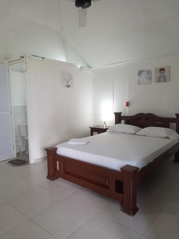 Cama ou camas em um quarto em Hotel EL PALMAR TOURS