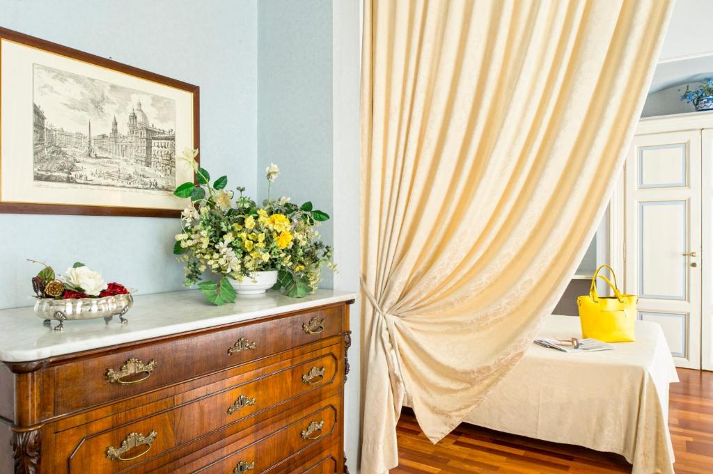 Postel nebo postele na pokoji v ubytování Grande Albergo Quattro Stagioni