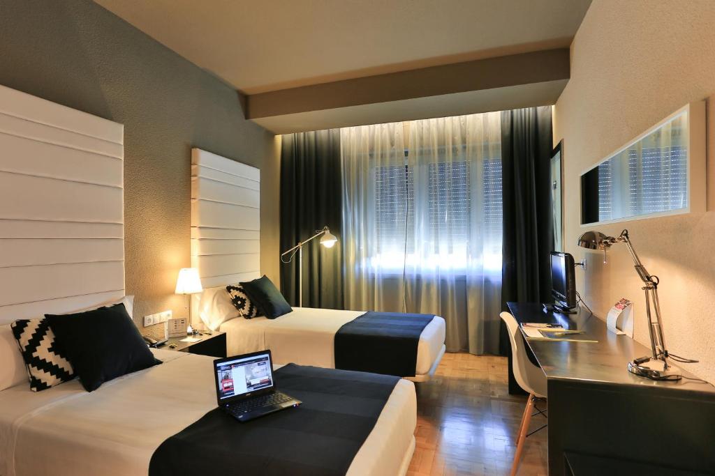 Postel nebo postele na pokoji v ubytování Habitus Hotel Leyre