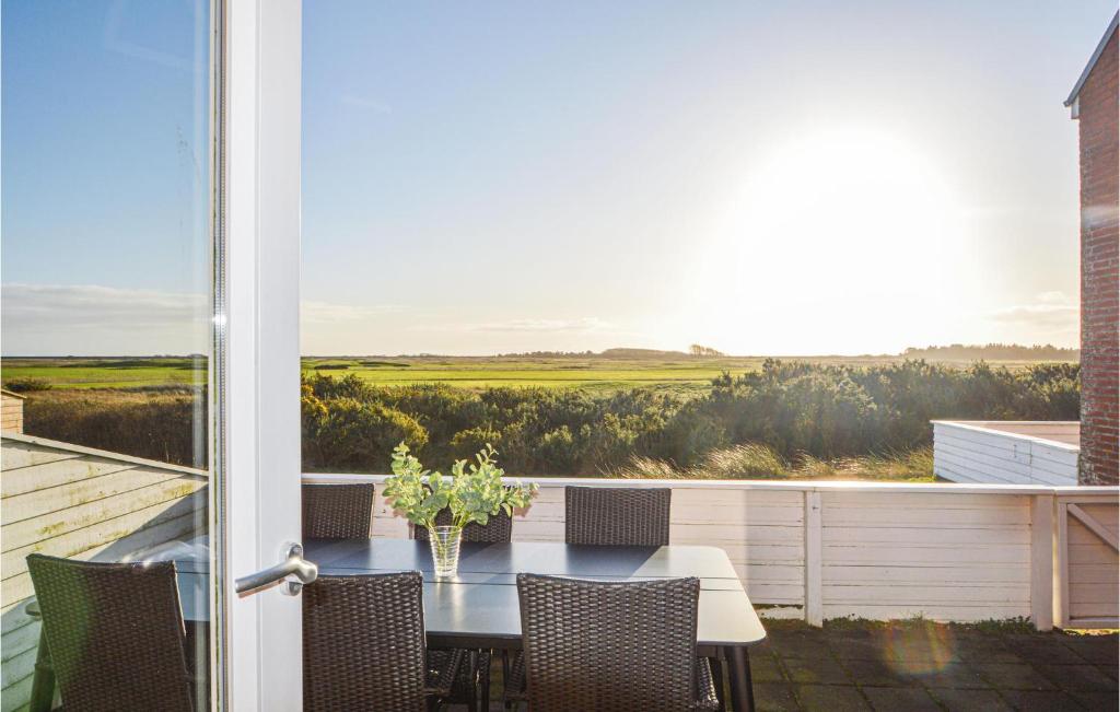 a patio with a table and chairs on a balcony at Apartment No 195 in Sønderby